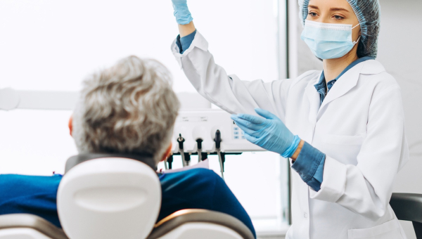 A dentist talking to her patient